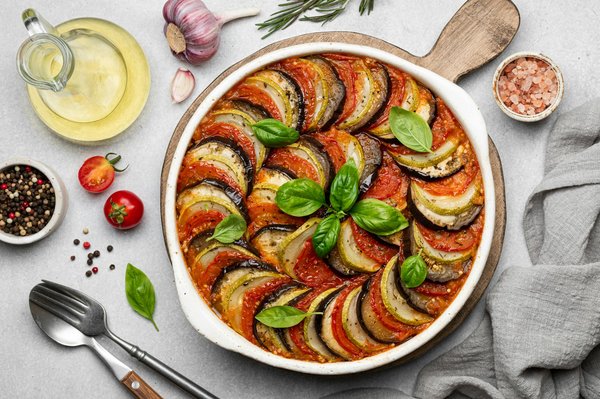 Quels sont les secrets pour une ratatouille au four avec des légumes bien confits?